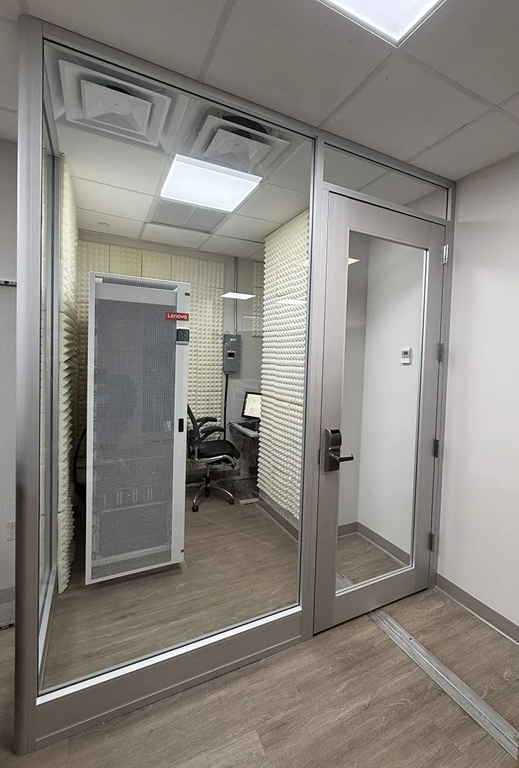 Recording room in laboratory featuring soundproof glass and paneling