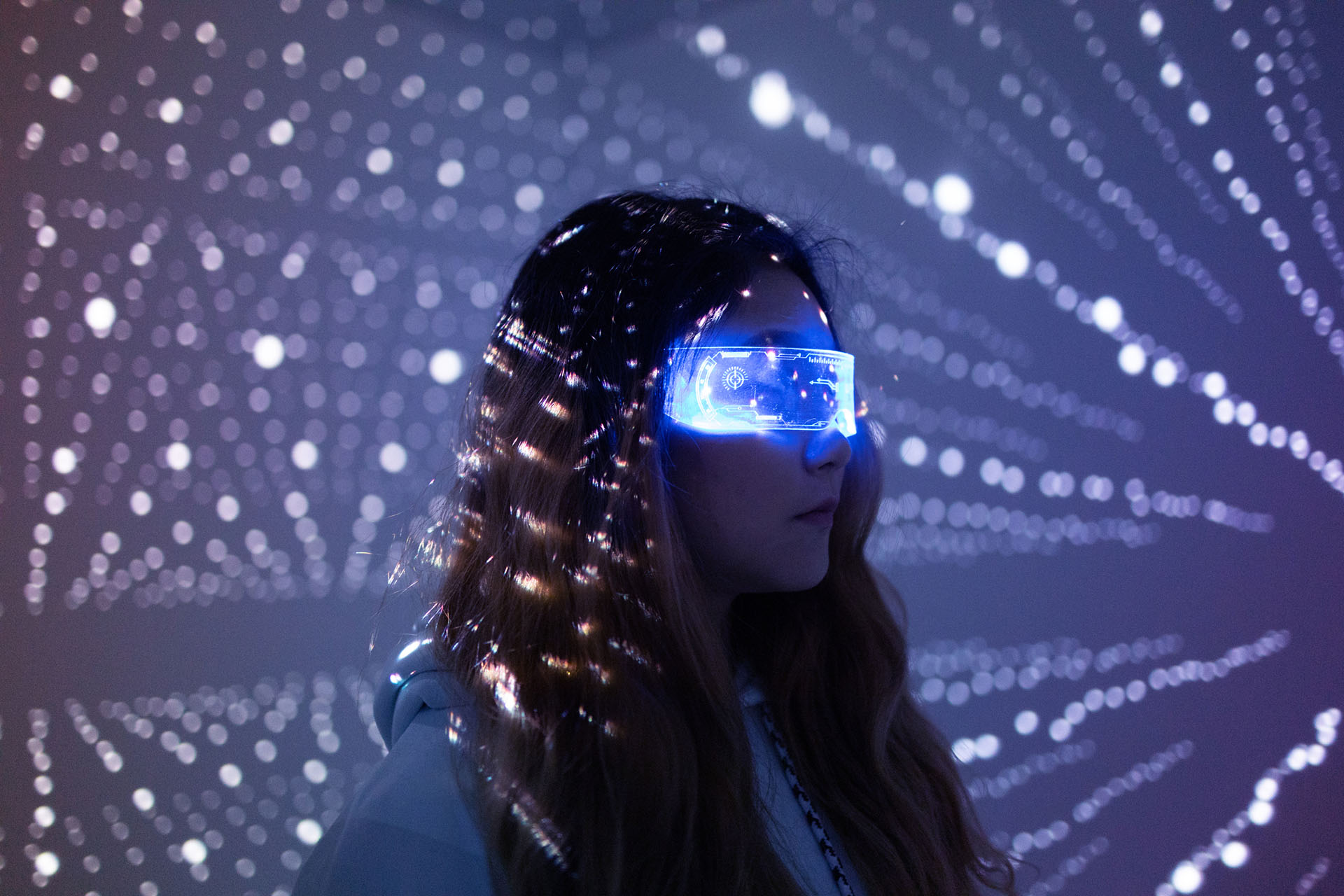Woman with futuristic goggles in a cyber environment