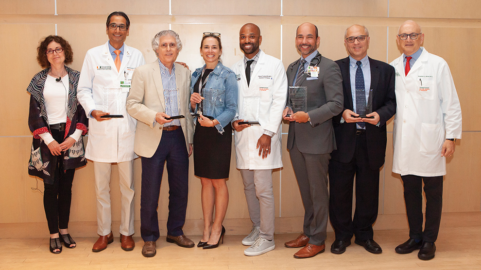From left, Titia de Lange, Ph.D., Peter J. Hosein, M.D., Robert B. Levy, Ph.D., Erin Kobetz, Ph.D., M.P.H., Hansel E. Tookes III, M.D., M.P.H., Gilberto Lopes, M.D., Wael El-Rifai, M.D., Ph.D., and Stephen D. Nimer, M.D.