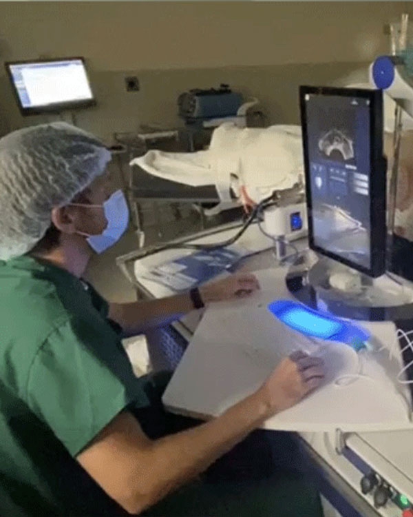 Bruno Nahar, M.D., at a workstation reviewing imagery
