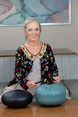 Woman playing two music instruments