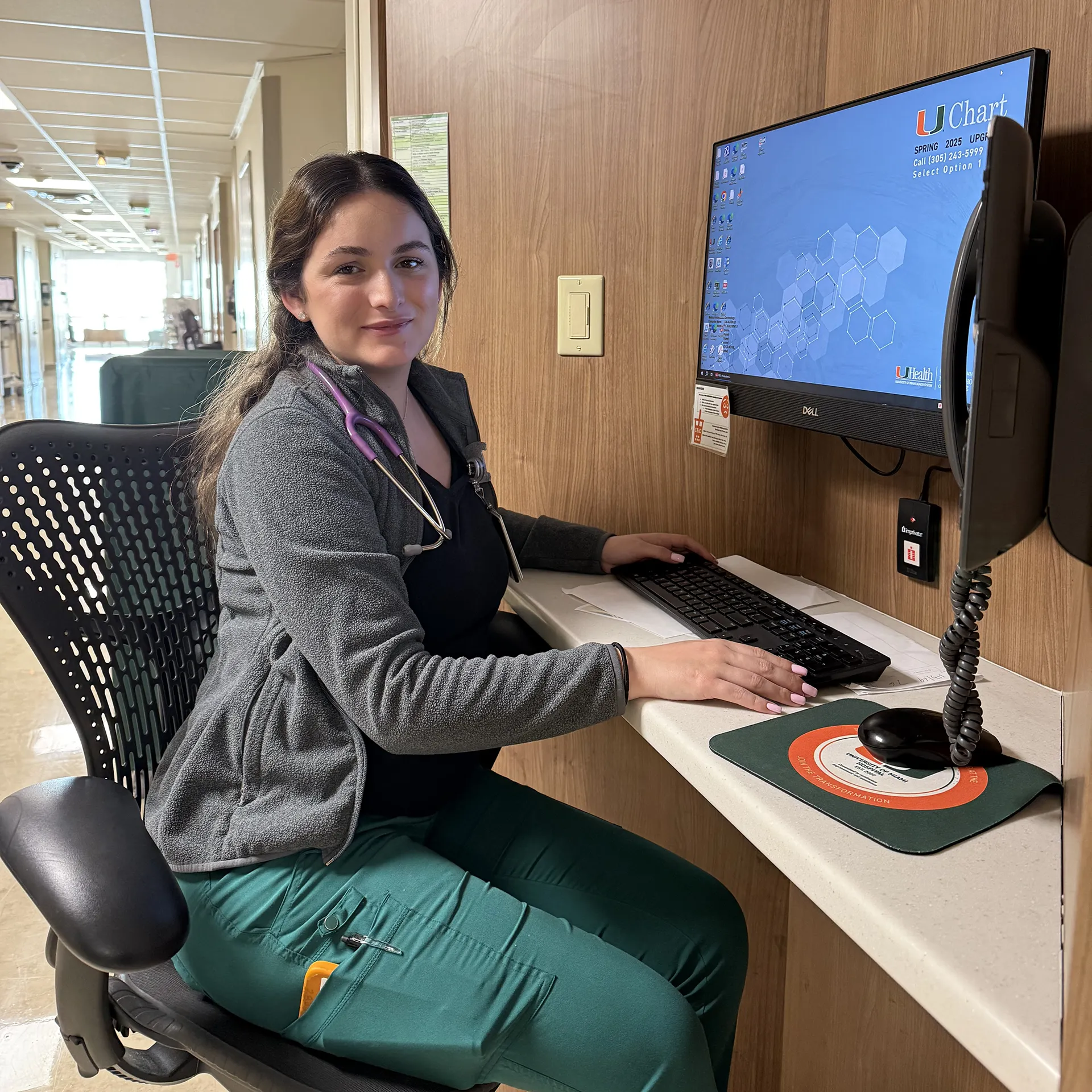 Nurse at a computer workstation at UHealth