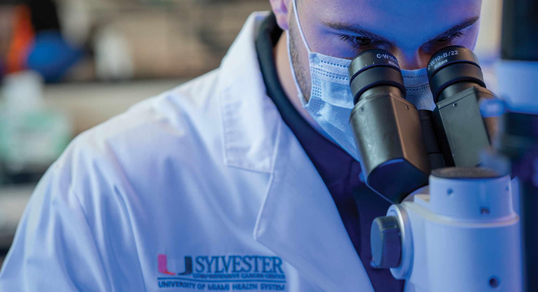 Scientist looking at growth in a petri dish